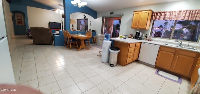 kitchen featuring white dishwasher, light tile patterned flooring, kitchen peninsula, and sink