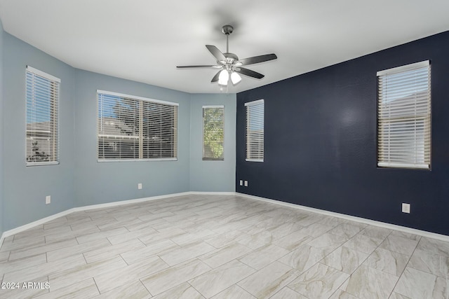 19034 W Yucatan Dr, Surprise, AZ 85388 - spare room with ceiling fan and baseboards