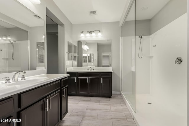 bathroom featuring vanity and a shower