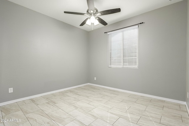 spare room with ceiling fan