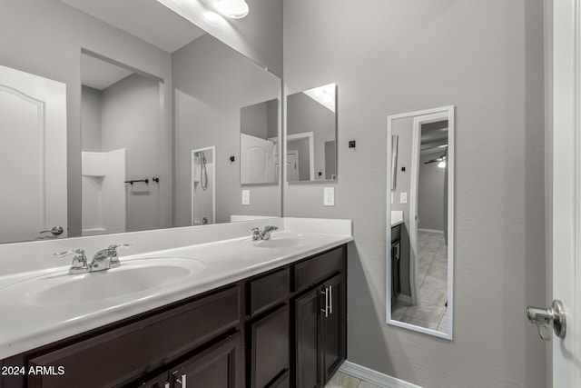 19034 W Yucatan Dr, Surprise, AZ 85388 - full bathroom with double vanity and baseboards