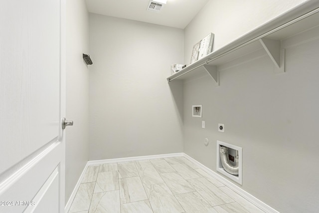 19034 W Yucatan Dr, Surprise, AZ 85388 - washroom with washer hookup, electric dryer hookup, light marble finish flooring, hookup for a gas dryer, and baseboards