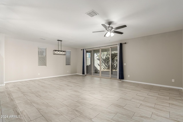 19034 W Yucatan Dr, Surprise, AZ 85388 - empty room featuring a ceiling fan and baseboards