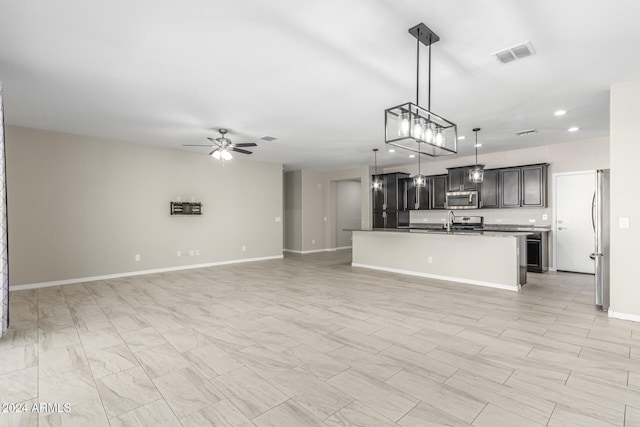 19034 W Yucatan Dr, Surprise, AZ 85388 - kitchen with stainless steel appliances, open floor plan, recessed lighting, and a ceiling fan