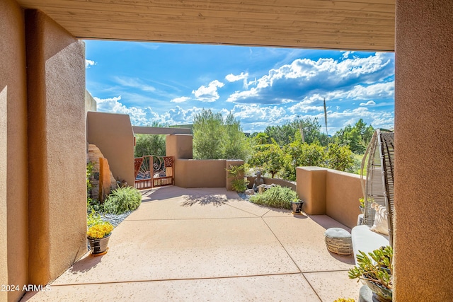 view of patio / terrace featuring a gate