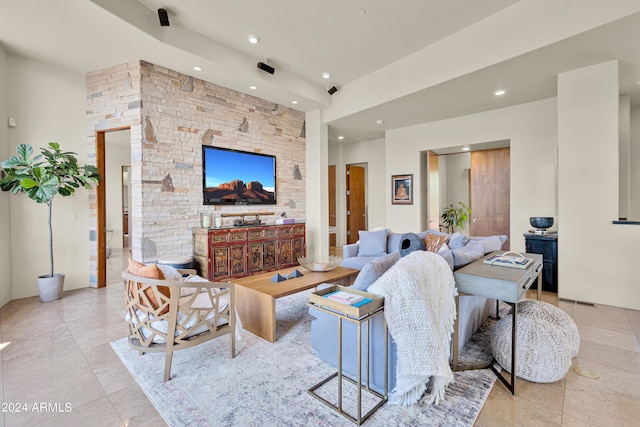 living area featuring recessed lighting and light tile patterned floors