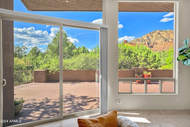 doorway with a mountain view and a wealth of natural light