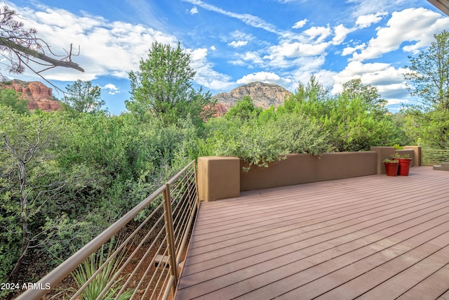 wooden deck featuring a mountain view