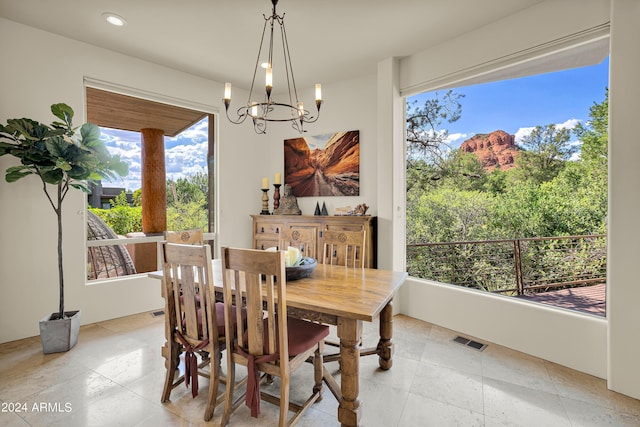 dining room with an inviting chandelier, light tile patterned floors, visible vents, and recessed lighting