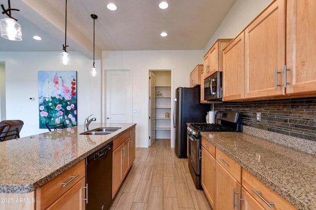 12935 E Ramos St, Dewey, AZ 86327 - kitchen featuring appliances with stainless steel finishes, a sink, decorative backsplash, light stone countertops, and pendant lighting