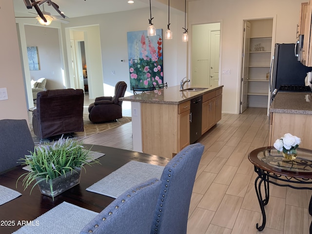 12935 E Ramos St, Dewey, AZ 86327 - kitchen with a sink, stainless steel appliances, open floor plan, a kitchen island with sink, and light brown cabinetry