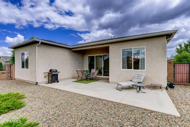 12935 E Ramos St, Dewey, AZ 86327 - back of property with stucco siding, a patio, and a gate