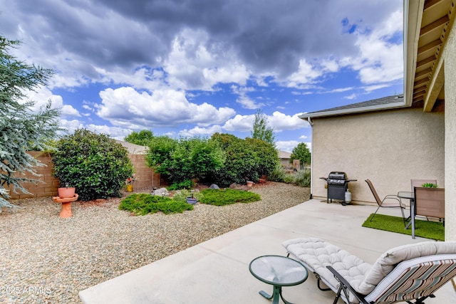 12935 E Ramos St, Dewey, AZ 86327 - fenced backyard featuring grilling area and a patio area