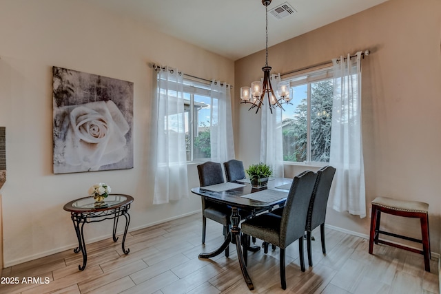 12935 E Ramos St, Dewey, AZ 86327 - dining space featuring plenty of natural light, a chandelier, baseboards, and wood finished floors