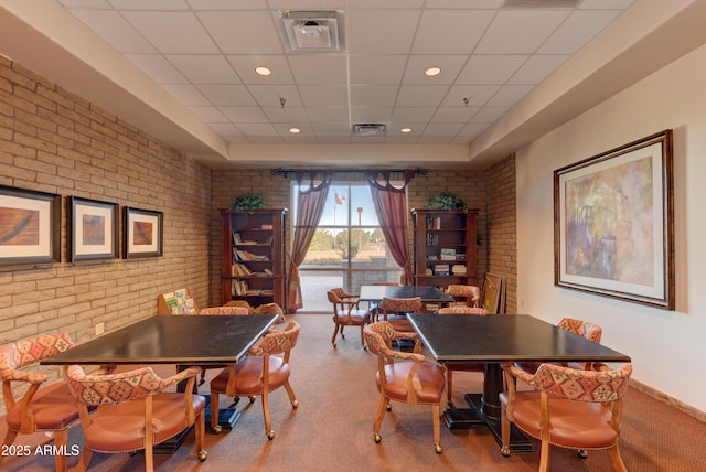 12935 E Ramos St, Dewey, AZ 86327 - carpeted dining room with a drop ceiling and brick wall