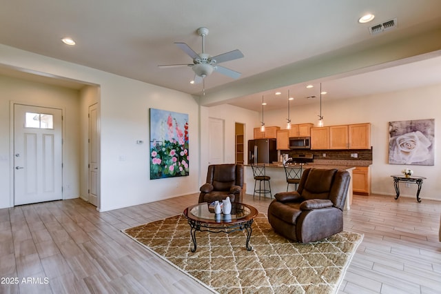 12935 E Ramos St, Dewey, AZ 86327 - living room featuring light wood-style floors, a ceiling fan, recessed lighting, and baseboards