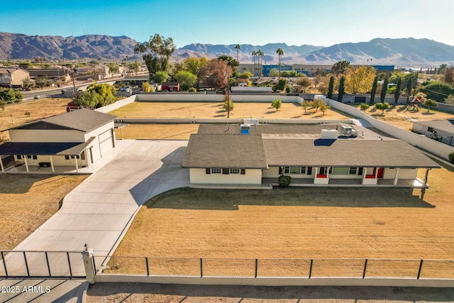 birds eye view of property featuring a mountain view