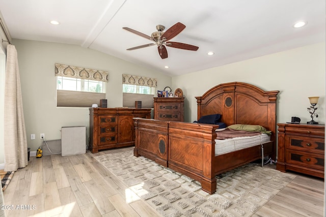 bedroom featuring vaulted ceiling with beams, ceiling fan, and light hardwood / wood-style flooring