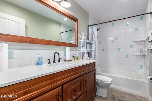 full bathroom featuring shower / bath combo, tasteful backsplash, vanity, wood-type flooring, and toilet