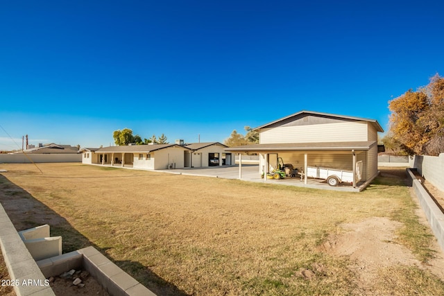 rear view of house with a yard