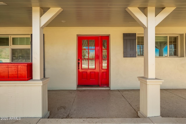 property entrance featuring a porch