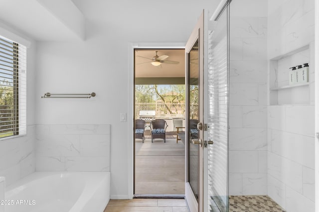 4301 E Abraham Ln, Phoenix, AZ 85050 - full bath with a bath, ceiling fan, and a shower stall