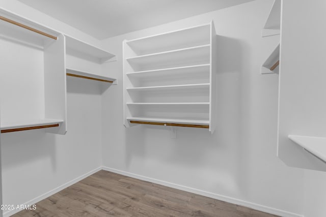 4301 E Abraham Ln, Phoenix, AZ 85050 - spacious closet with wood finished floors
