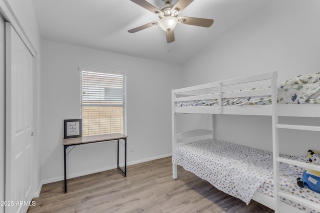 4301 E Abraham Ln, Phoenix, AZ 85050 - bedroom with wood finished floors, a closet, and a ceiling fan