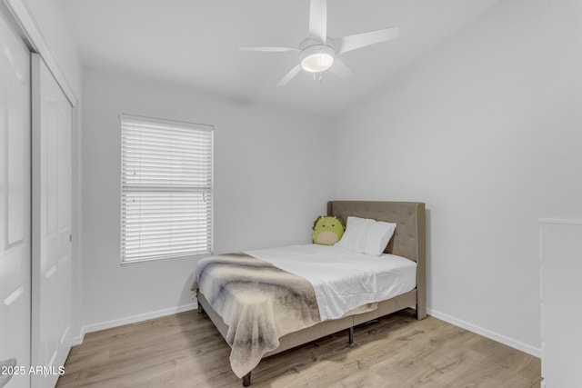 4301 E Abraham Ln, Phoenix, AZ 85050 - bedroom with a closet, wood finished floors, ceiling fan, and vaulted ceiling
