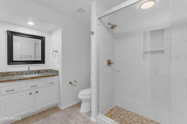 4301 E Abraham Ln, Phoenix, AZ 85050 - full bathroom featuring vanity, tiled shower, and wood finished floors