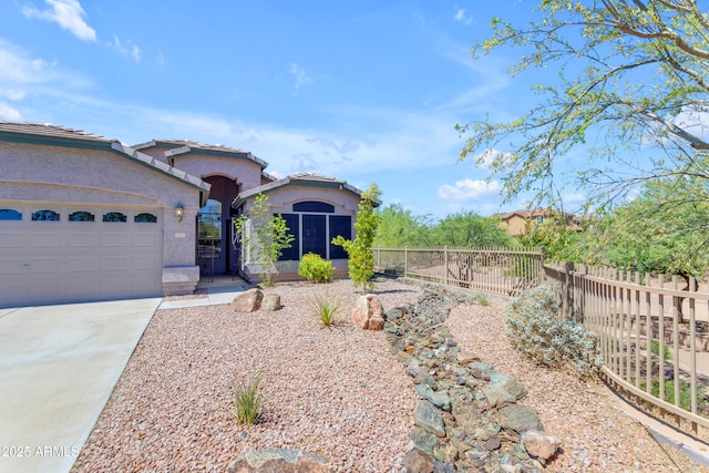 4301 E Abraham Ln, Phoenix, AZ 85050 - mediterranean / spanish home featuring stucco siding, driveway, and a garage