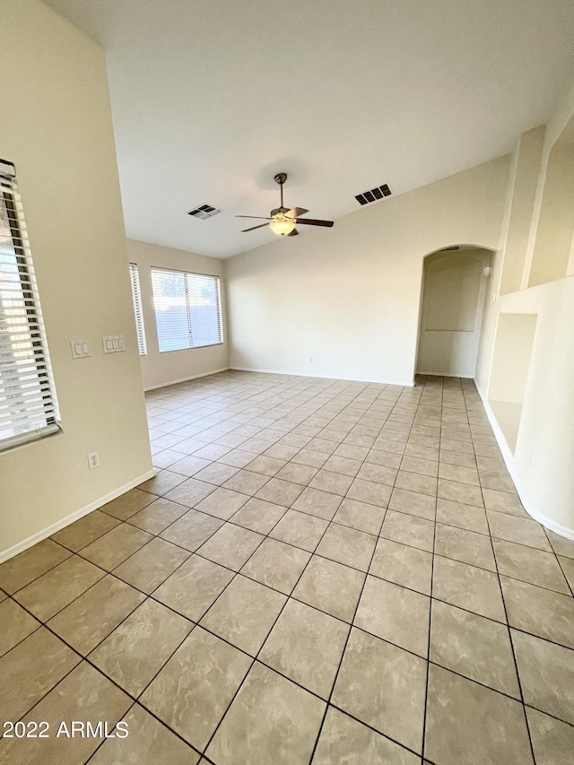 spare room with light tile patterned flooring and ceiling fan