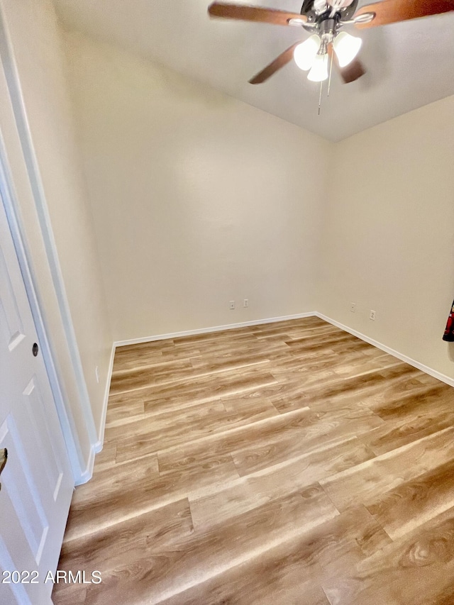 unfurnished room with wood-type flooring and ceiling fan