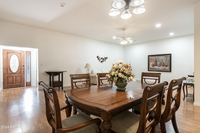 dining room featuring light hardwood / wood-style flooring and ceiling fan