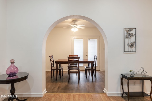 dining area featuring ceiling fan, french doors, and hardwood / wood-style floors