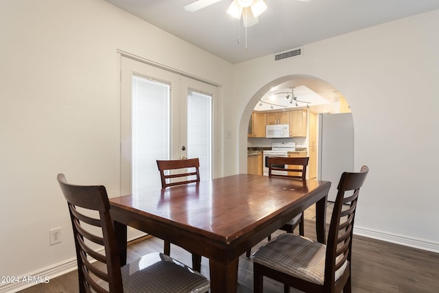 dining area with french doors, ceiling fan, and dark hardwood / wood-style flooring