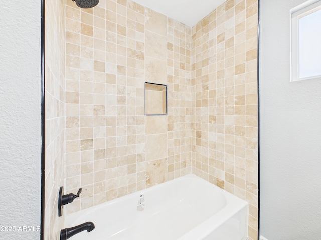 2628 W Marshall Ave, Phoenix, AZ 85017 - full bathroom with a textured wall and  shower combination