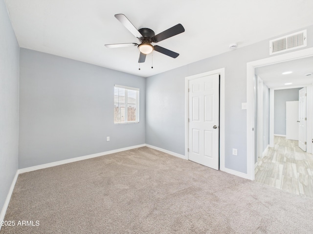 2628 W Marshall Ave, Phoenix, AZ 85017 - unfurnished bedroom with visible vents, baseboards, a ceiling fan, and carpet flooring