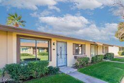 ranch-style home with a front lawn