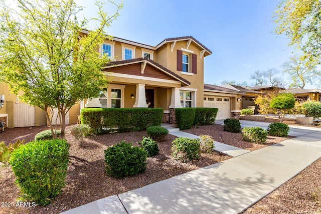 craftsman-style house featuring a garage, stone siding, concrete driveway, and stucco siding