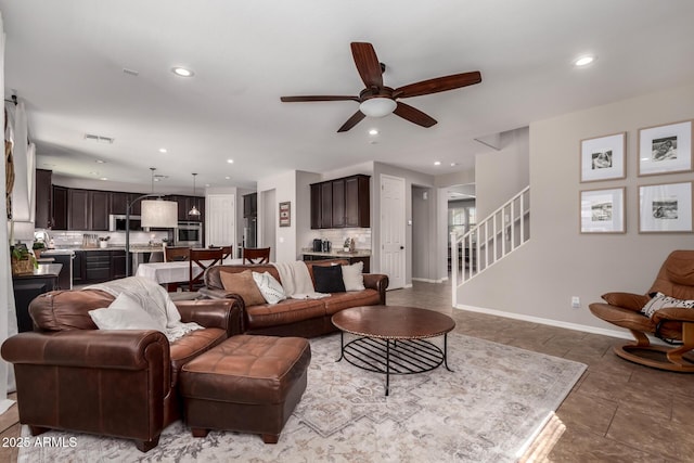 living room with recessed lighting, visible vents, stairway, and baseboards