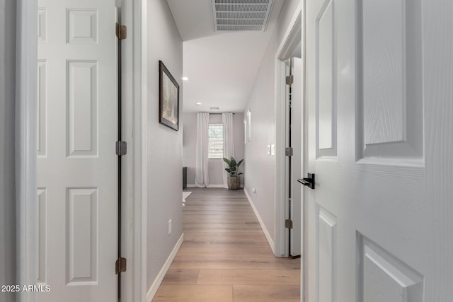 hall with recessed lighting, baseboards, visible vents, and light wood finished floors