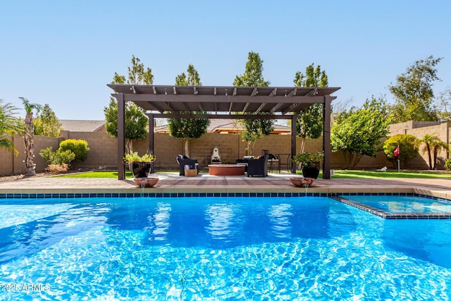 view of swimming pool featuring a fenced backyard, a pool with connected hot tub, a pergola, and a patio