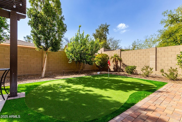 view of yard with a fenced backyard