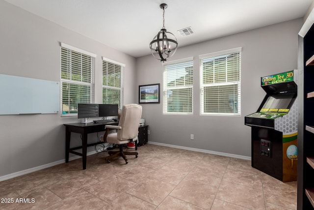 office space featuring a chandelier, light tile patterned flooring, visible vents, and baseboards