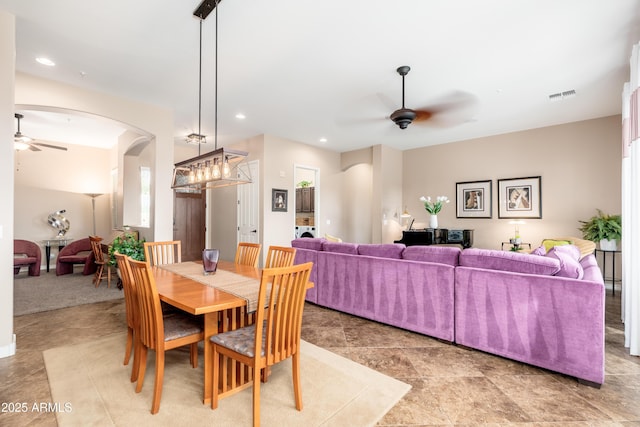 dining space featuring visible vents, arched walkways, ceiling fan, and recessed lighting