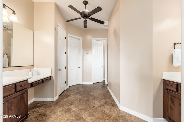 bathroom with vanity, a ceiling fan, and baseboards