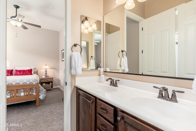 full bath featuring ensuite bathroom, a sink, a ceiling fan, and double vanity