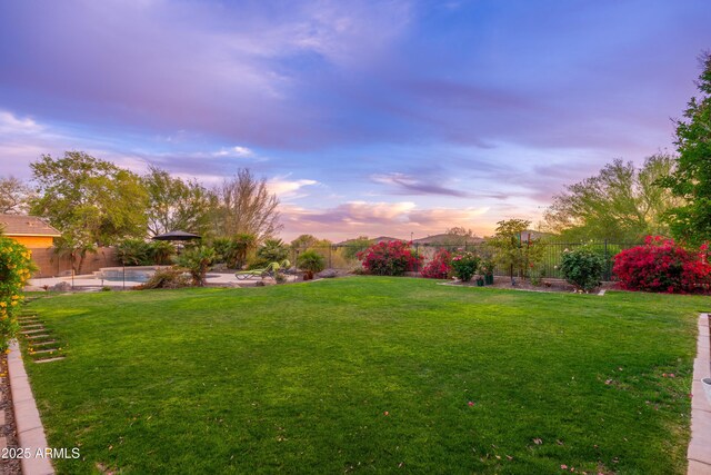 view of yard with a fenced backyard and a fenced in pool