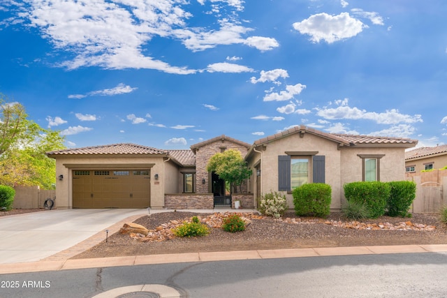 mediterranean / spanish house featuring a tiled roof, a garage, fence, and stucco siding
